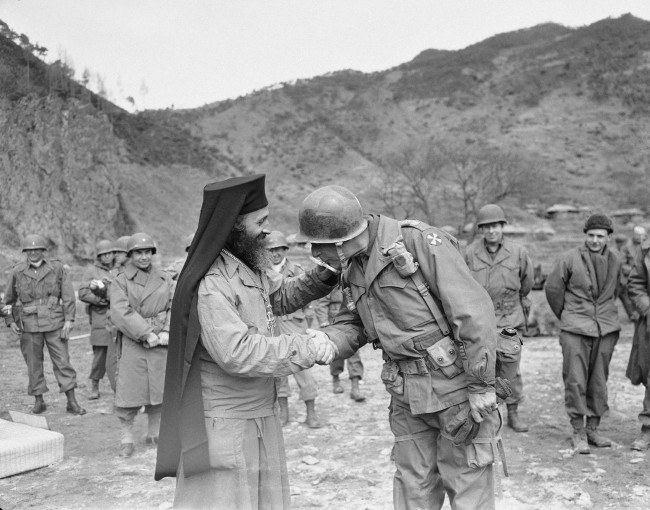 chaplain with soldiers
